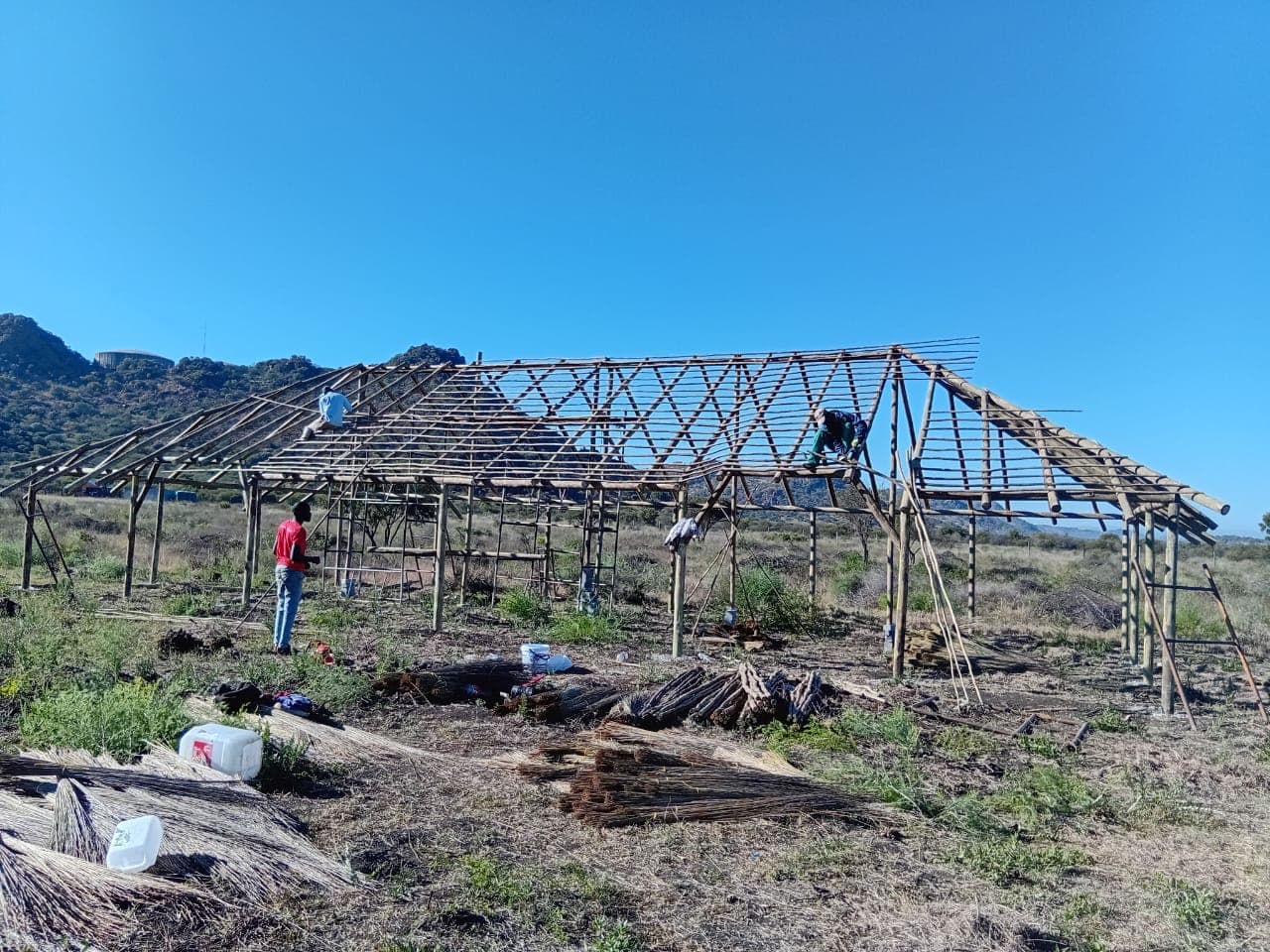 Building the roof lattice on a thatched lapa structure